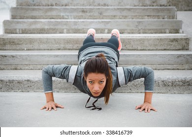 Urban Fitness Woman Workout Doing Feet Elevated Push Ups On Urban Park Stairs. Motivated Female Athlete Training Hard.