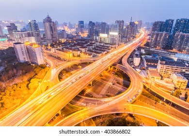 urban grade separation bridge in nightfall , shanghai ,China - Shutterstock ID 403866802