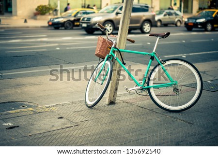 Urban green Bicycle parked in the street