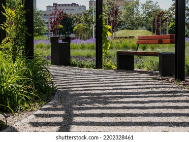 Urban green spaces - walking paths. A small downtown park with numerous flowering plants and shaded alleys, benches etc. Green recreational areas.  - Shutterstock ID 2202328461