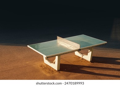 Urban isolated green ping pong table in sun - Powered by Shutterstock