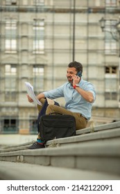 Urban Italian And Happy Buisnessman Talking On His Phone With His Partners