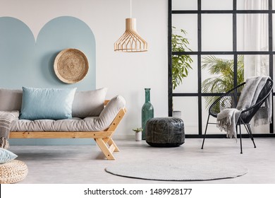 Urban Jungle In Bright White And Blue Living Room Interior With Scandinavian Futon Sofa