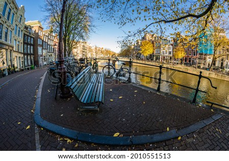 Similar – Foto Bild Architektur niederländischer Häuser Fassade und Hausboote am Amsterdamer Kanal