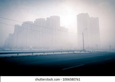 Urban Landscape. Foggy Winter Cityscape. Foggy City Street With Silhouettes Of Residential Buildings.