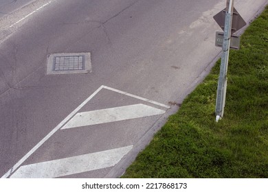 Urban Landscape Of A Road From Above With Signs And Painted Lines.