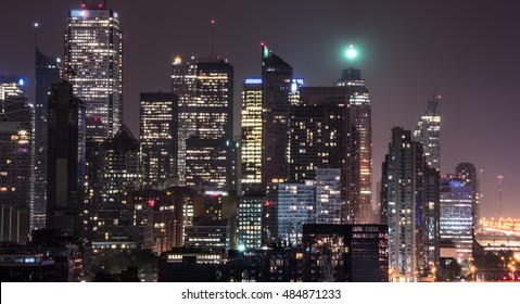 Urban Lighted Landscape Of Toronto.    Skyline Of Buildings And Office Towers On A Hot, Rainy And Humid August Night In The Capitol Of Ontario, Canada