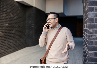 An Urban Man Having Phone Conversation Outside.