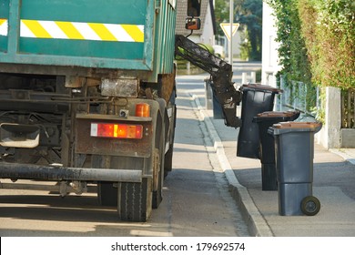 Urban Municipal Recycling Garbage Collector Truck Loading Waste And Trash Bin