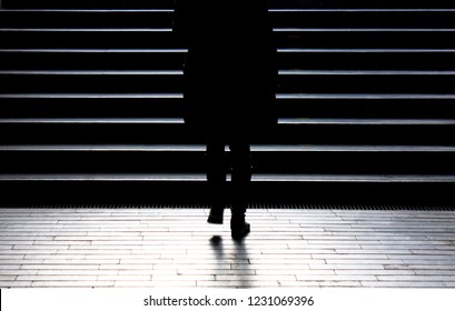 Urban Night Walk : Blurry Silhouette Of Young Woman Climbing Up The City Street Public Stairs In The Peaceful Winter Moonlight , Alone, From Behind