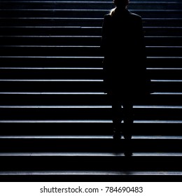 Urban Night Walk : Blurry Silhouette Of Young Elegant Independent Woman Climbing Up The City Street Public Stairs In The Peaceful Moonlight , Alone, From Behind