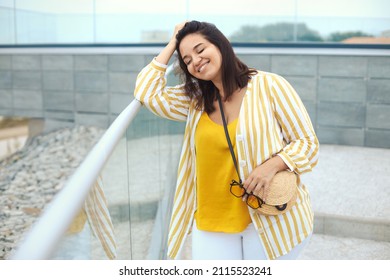 Urban Portrait Of Beautiful Happy Plus Size Latin Woman 30-35 Years Old Smiling With Close Eyes And Enjoy The Summer Vacation.