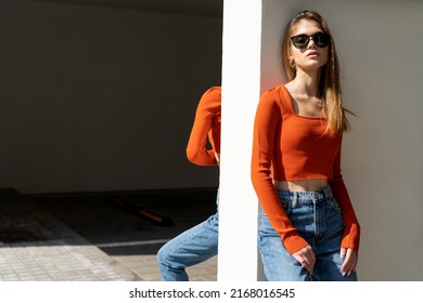 Urban portrait of a beautiful woman wearing sunglasses - Shutterstock ID 2168016545
