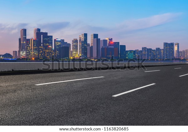 Urban road asphalt pavement and skyline of
Hangzhou architectura