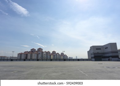 Urban Rooftop Carpark On City Background