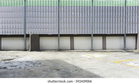 Urban Rooftop Carpark On City Background