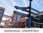 Urban Signpost with Modern Architecture, Blue Sky Background