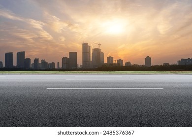 Urban Skyline at Sunset with Empty Road - Powered by Shutterstock