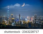 Urban splendor at night: Watch the dynamic clouds and moon above the cityscape. View of Taipei city from the Four Beasts Mountain Trail, Taiwan