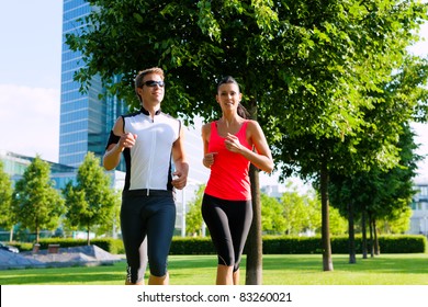 Urban Sports - Couple Jogging For Fitness In The City On A Beautiful Summer Day