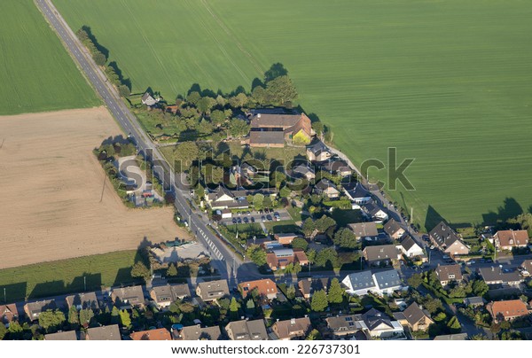 Urban\
sprawl in the Lower Rhine Region of Germany - Aerial view of\
Rheinberg, North Rhine-Westfalia, Germany,\
Europe