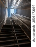 Urban Stairway and Escalator Leading to a Modern Cityscape.