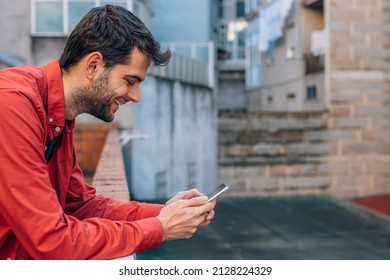 urban style man using mobile or cell phone in the street outdoors