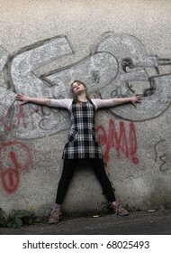 Urban Teenage Girl Against Wa Graffitti Wall