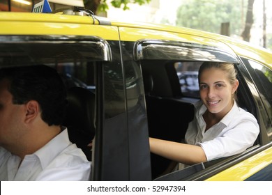 urban transport: happy female passenger inside of a taxi - Powered by Shutterstock