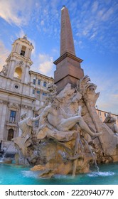 Urban view of Rome, Italy: Fountain of the Four Rivers (Fontana dei Quattro Fiumi) with an Egyptian obelisk in Navon Square (Piazza Navona): on background the church of Sant’Agnese in Agone. - Shutterstock ID 2220940779