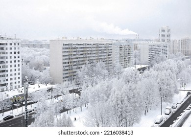 Urban winter landscape. A snow-covered city street, trees covered with snow. View from above. Cloudy winter day, soft light. - Powered by Shutterstock