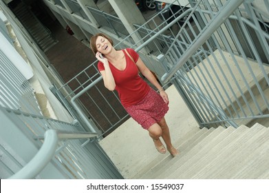 Urban Woman Walking Up Stairs.