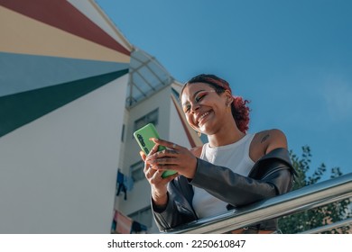urban young girl on the street with mobile phone - Shutterstock ID 2250610847