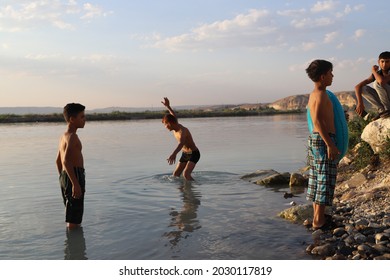 Urfa, Turkey 2021. Karahan Region. Syrian Refugee Children Playing In The Lake.