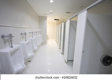 Urinals In Commercial Bathroom.