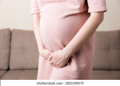 Urinary Incontinence During Pregnancy. Abdominal Pain During Pregnancy. Maternity Healthcare Concept .