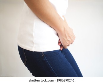 Urinary Tract Infection In Woman And Hand Holding Pressing Her Lower Abdomen On White Background For Health Care Concept.