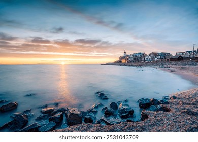 Urk Netherlands, small authentic fishing village with a colorful lighthouse on the coast of the IJsselmeer lake. Netherlands Flevoland Europe - Powered by Shutterstock