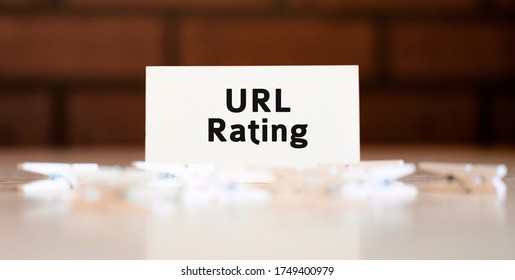 Url Rating Text Of Business Concept On White List And With Clothespins