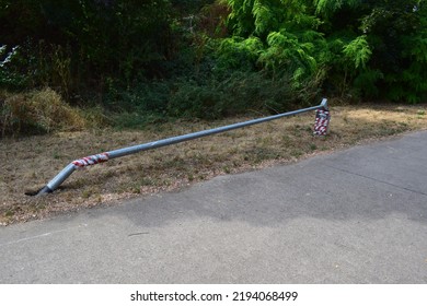 Urmitz, Germany - 08 22 2022: Fallen Lamp Post With Red And White Markers, A German Solution