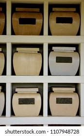 Urns With Ashes In A Columbarium Wall