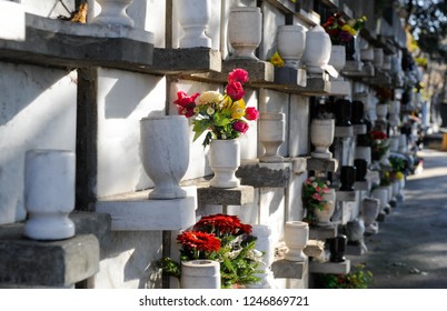Urns with ashes in a columbarium wall of the cemetery
