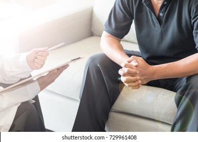 Urologist Doctor Giving Consult For Prostate Problems To Patient. Urologic Oncologists Specialize In Treating Cancer Of The Urinary Tract And Male Reproductive Organs.