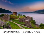 Urquhart Castle at sunset located on the banks of Loch ness, Scotland.