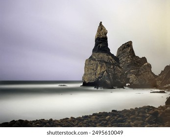 Ursa rock from Ursa beach in an overcas full moon night. Long exposure. Analog: 120 film. - Powered by Shutterstock