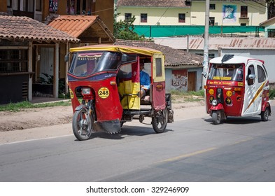 URUBAMBA, PERU - MARCH 10: Auto rickshaw drives down the street in Urubamba, Peru on March 10, 2015