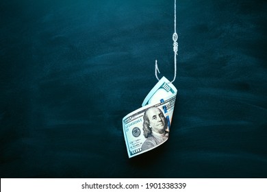 US 100 dollar bill as a bait. American currency on the hook. Investment risk or money trap, business fraud and cheating or financial pitfall and mistake concept. Copy space.