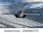 U.S. Air Force F-22 Raptors from Joint Base Elmendorf-Richardson, fly in formation over the Joint Pacific Alaska Range Complex