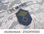 US AIR FORCE Master Sergeant rank patch on digital tiger stripe pattern Airman Battle Uniform background