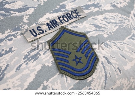 US AIR FORCE Master Sergeant rank patch on digital tiger stripe pattern Airman Battle Uniform background